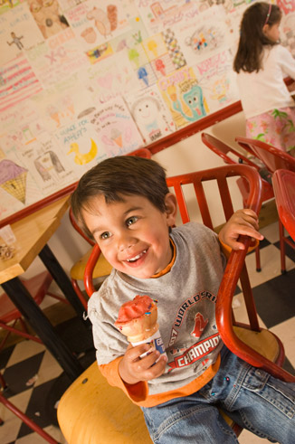 little boy with big smile and an ice cream cone
