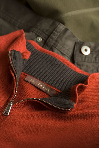 close up of mens trousers and red bentley sweater