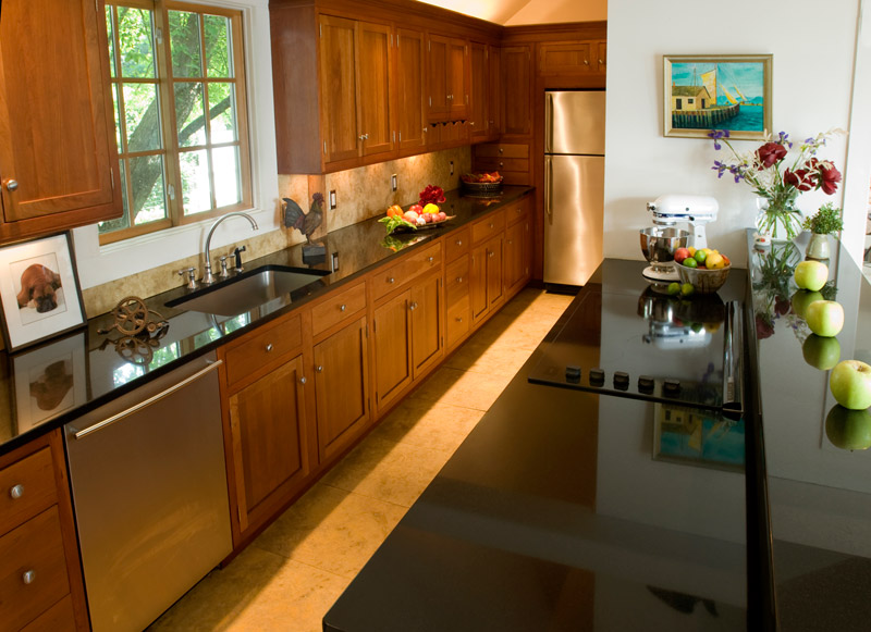 modern kitchen showing cabnetry and custom counters
