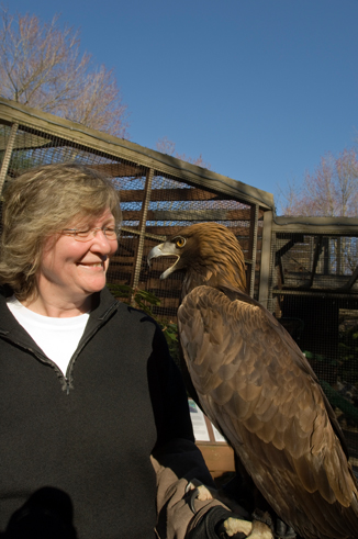 woman holding golden eagle